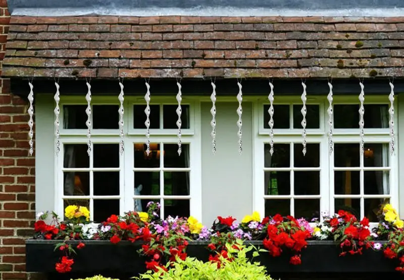 using bird scarers - spiral rods hung infront of house