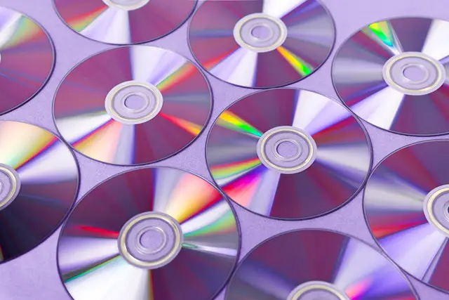 photo of CDs laid on a flat surface 