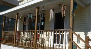ways to get rid of birds on the porch - porch with multiple wind chimes